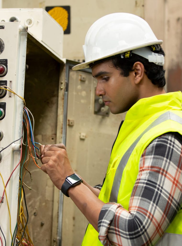 Industrial Engineers in Hard Hats.Work at the Heavy Industry Manufacturing Factory.industrial worker indoors in factory.aged man working in an industrial